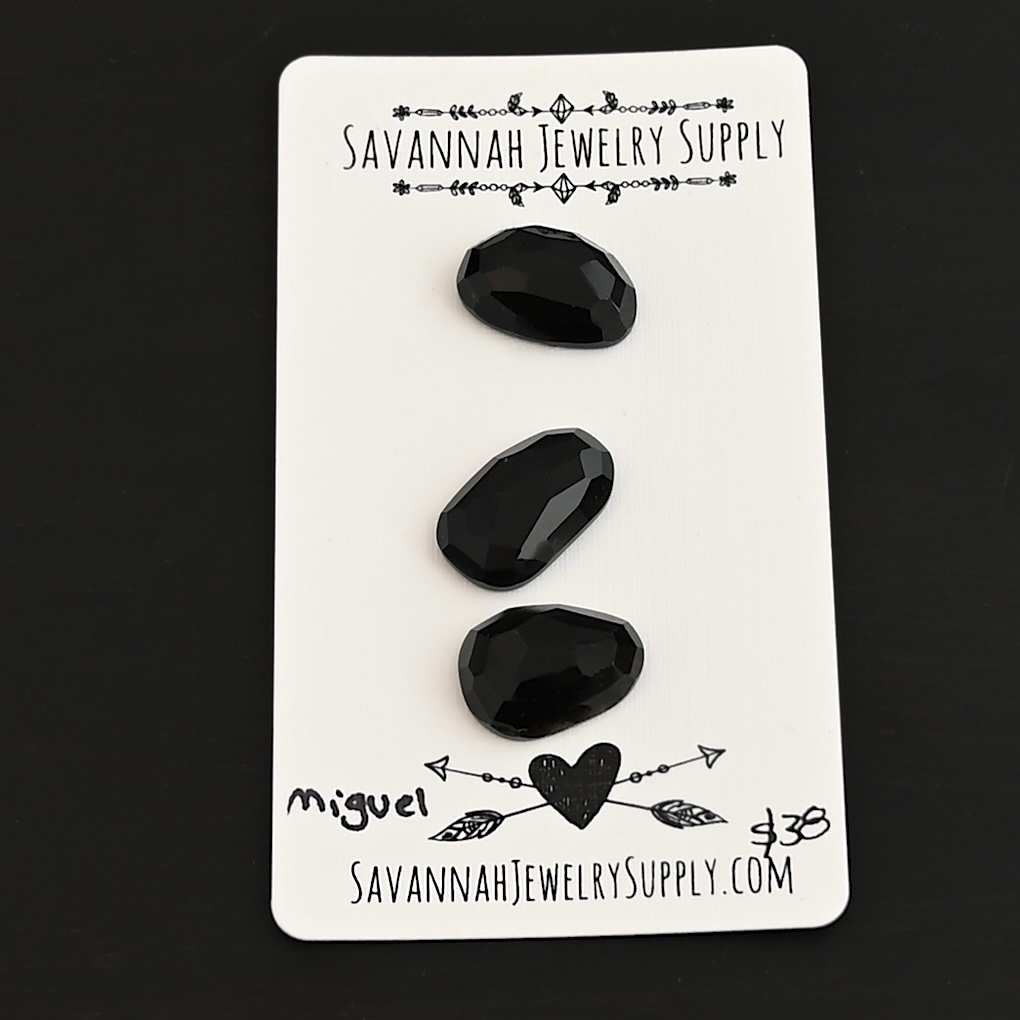 Miguel Black Onyx Cabochon Parcel shown on business card