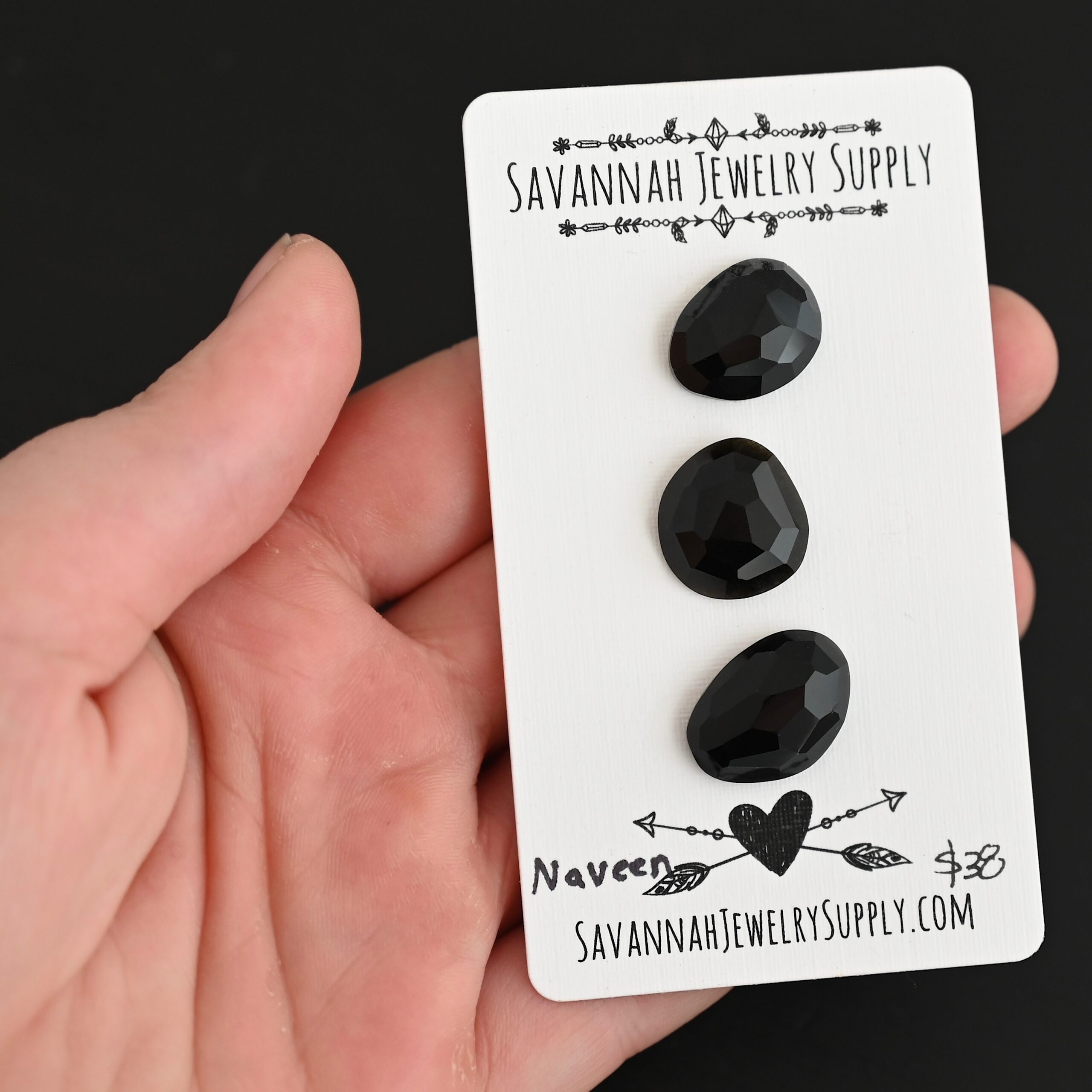 Naveen Black Onyx Cabochon Parcel shown in hand