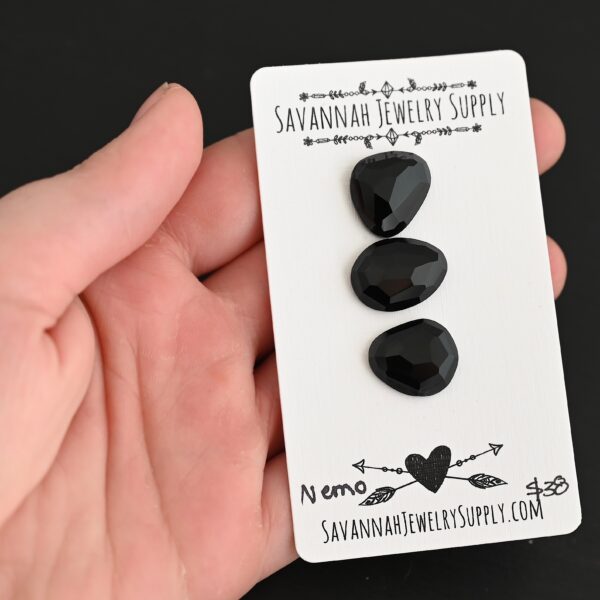 Nemo Black Onyx Cabochon Parcel shown in hand