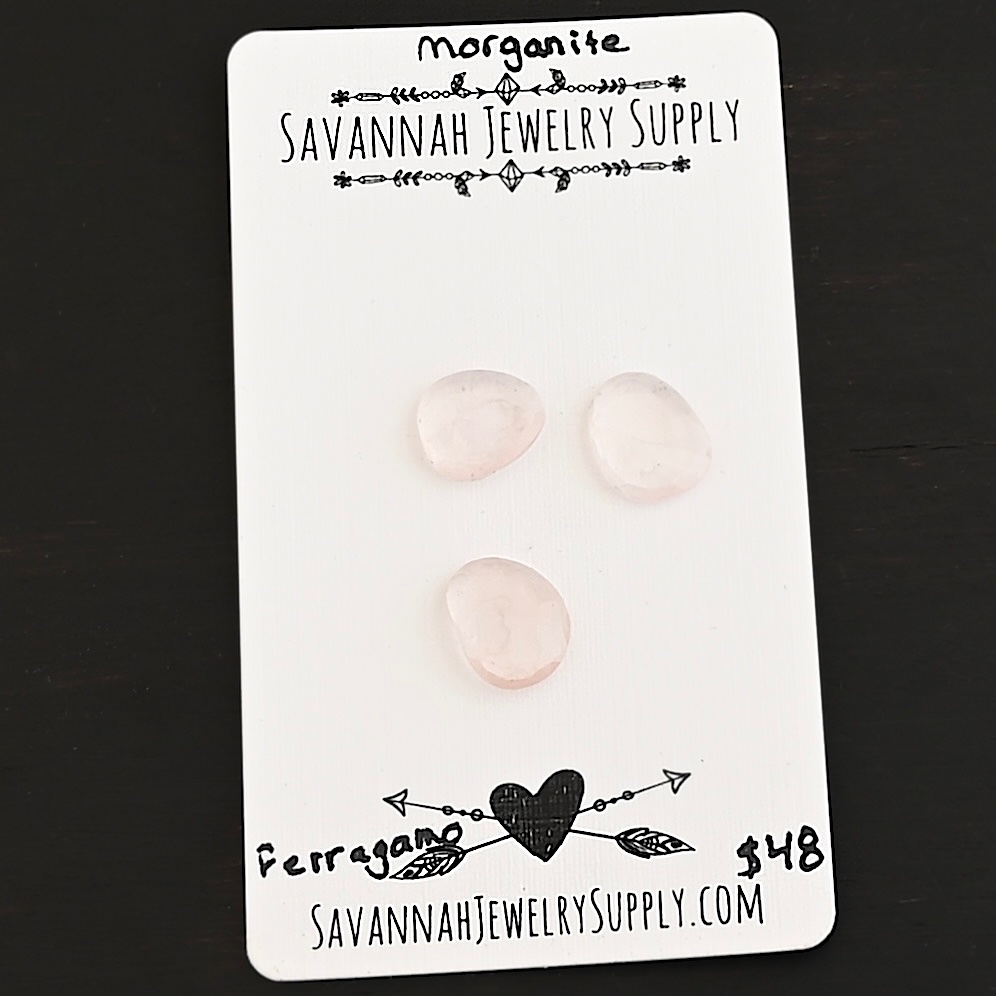 Ferragano Rose Cut Morganite Cabochon Parcel shown on business card