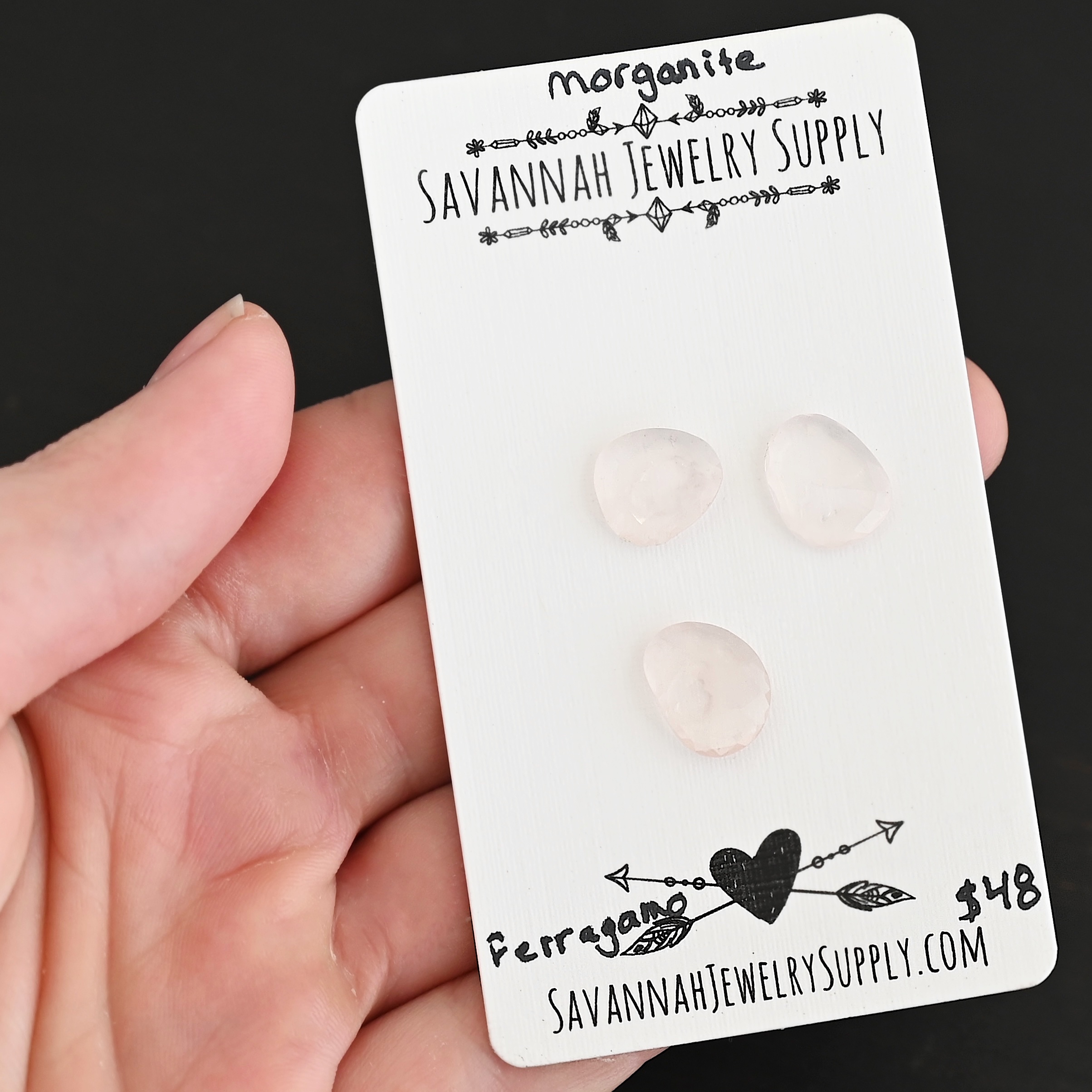 Ferragano Rose Cut Morganite Cabochon Parcel shown in hand