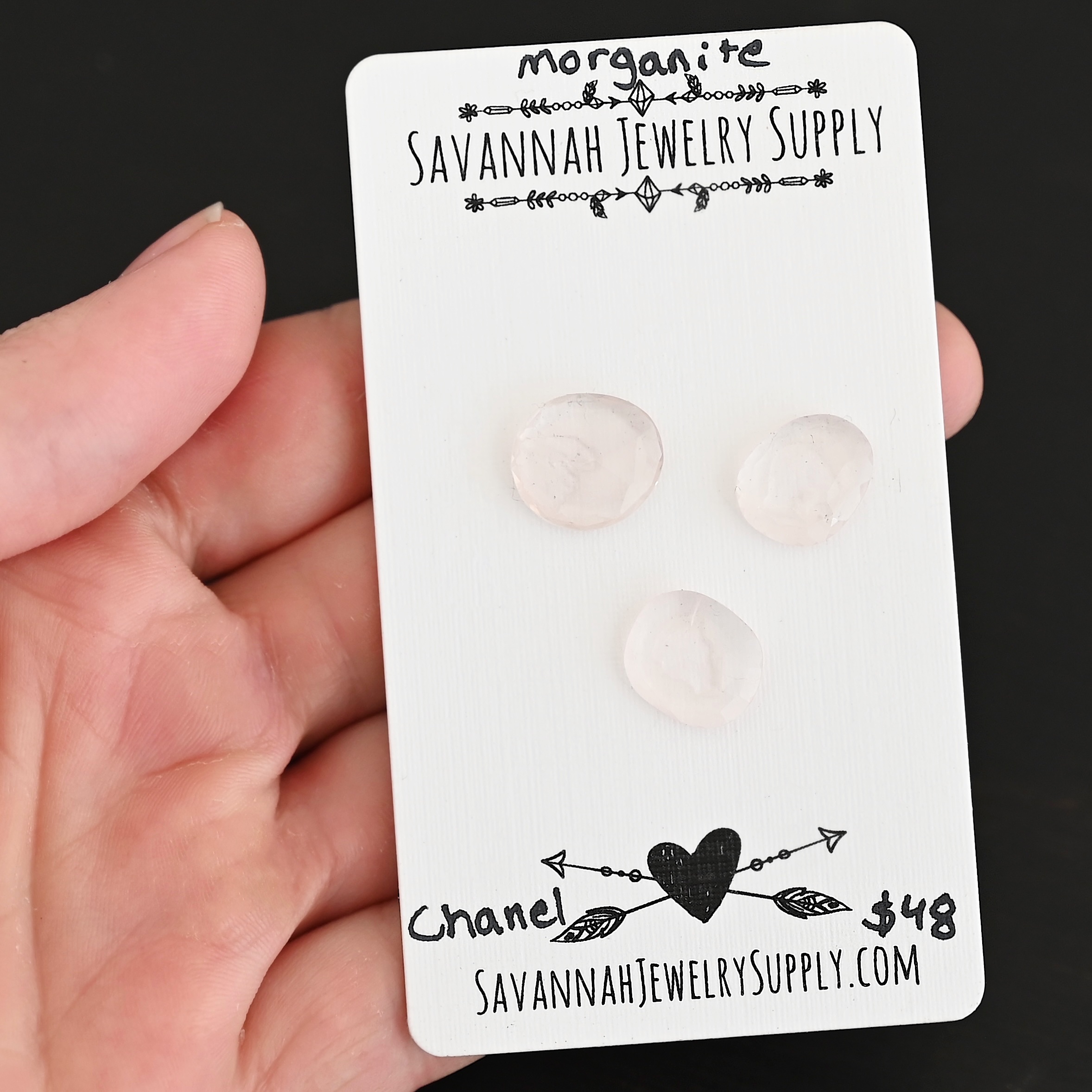 Chanel Rose Cut Morganite Cabochon Parcel shown in hand