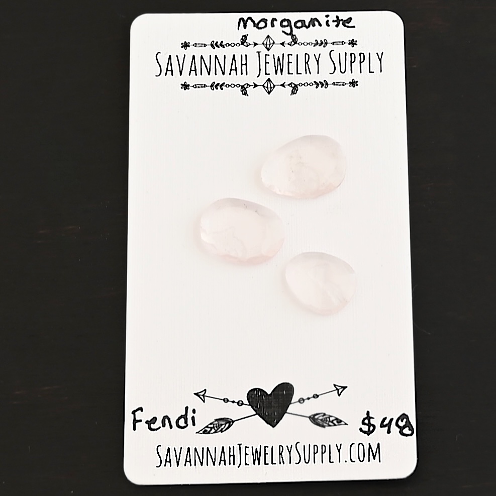 Fendi Rose Cut Morganite Cabochon Parcel shown on business card