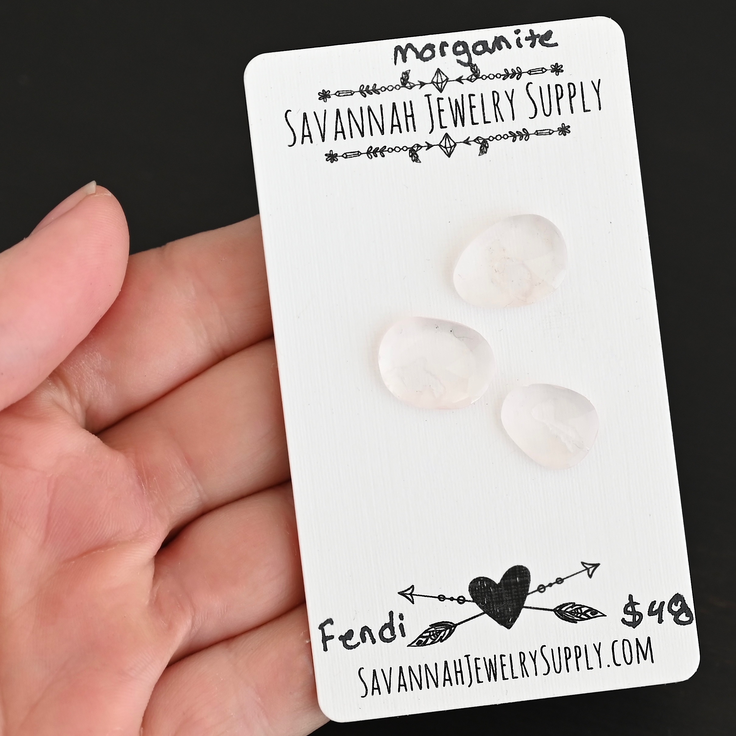 Fendi Rose Cut Morganite Cabochon Parcel shown in hand