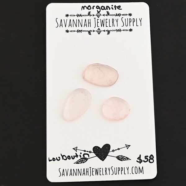 Louboutin Rose Cut Morganite Cabochon Parcel shown on business card