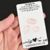 Louboutin Rose Cut Morganite Cabochon Parcel shown in hand