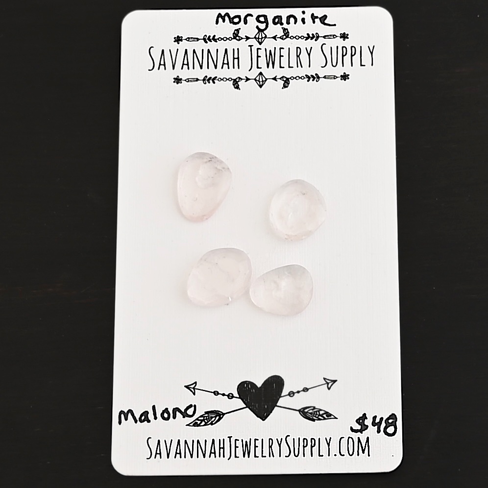 Malono Rose Cut Morganite Cabochon Parcel shown on business card