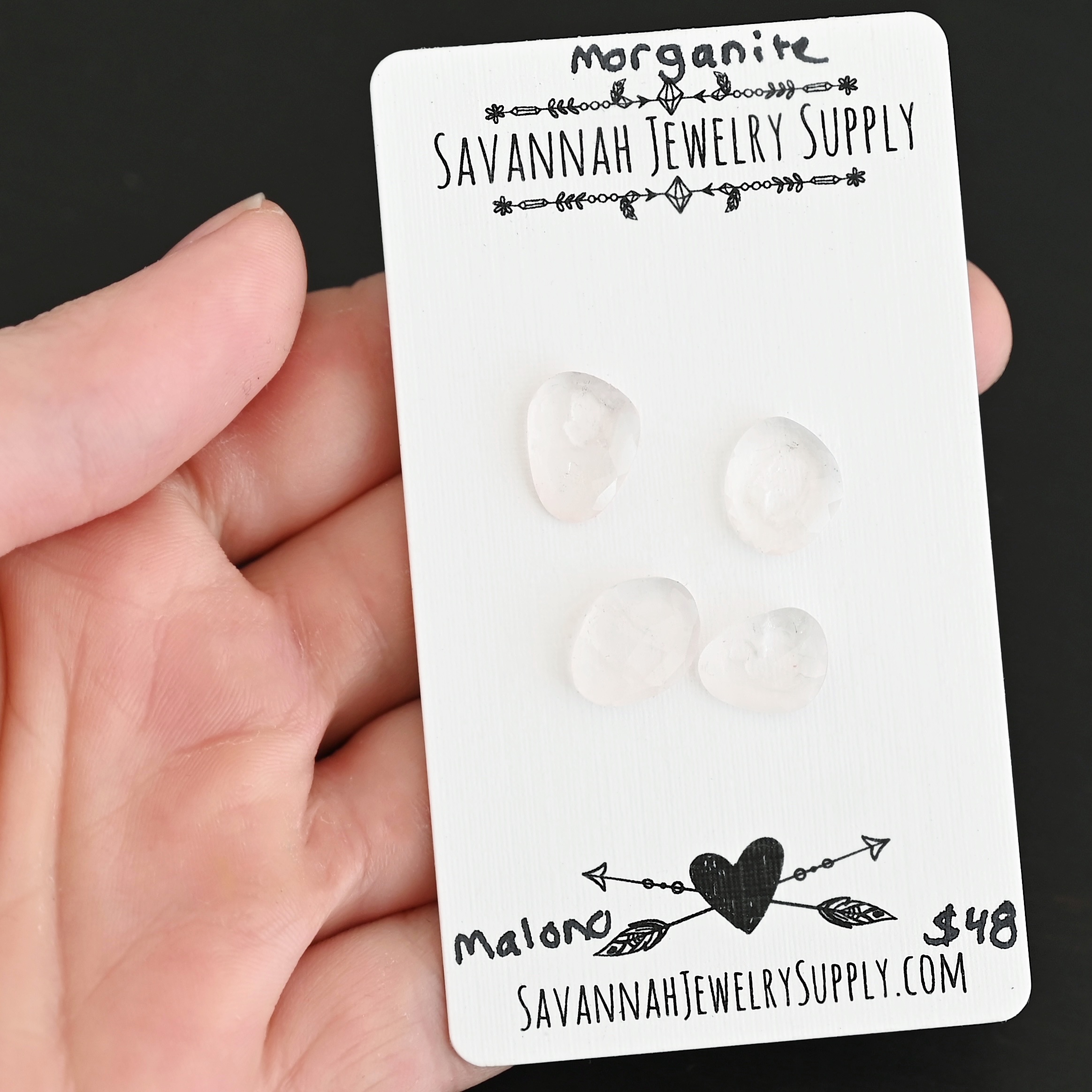 Malono Rose Cut Morganite Cabochon Parcel shown in hand