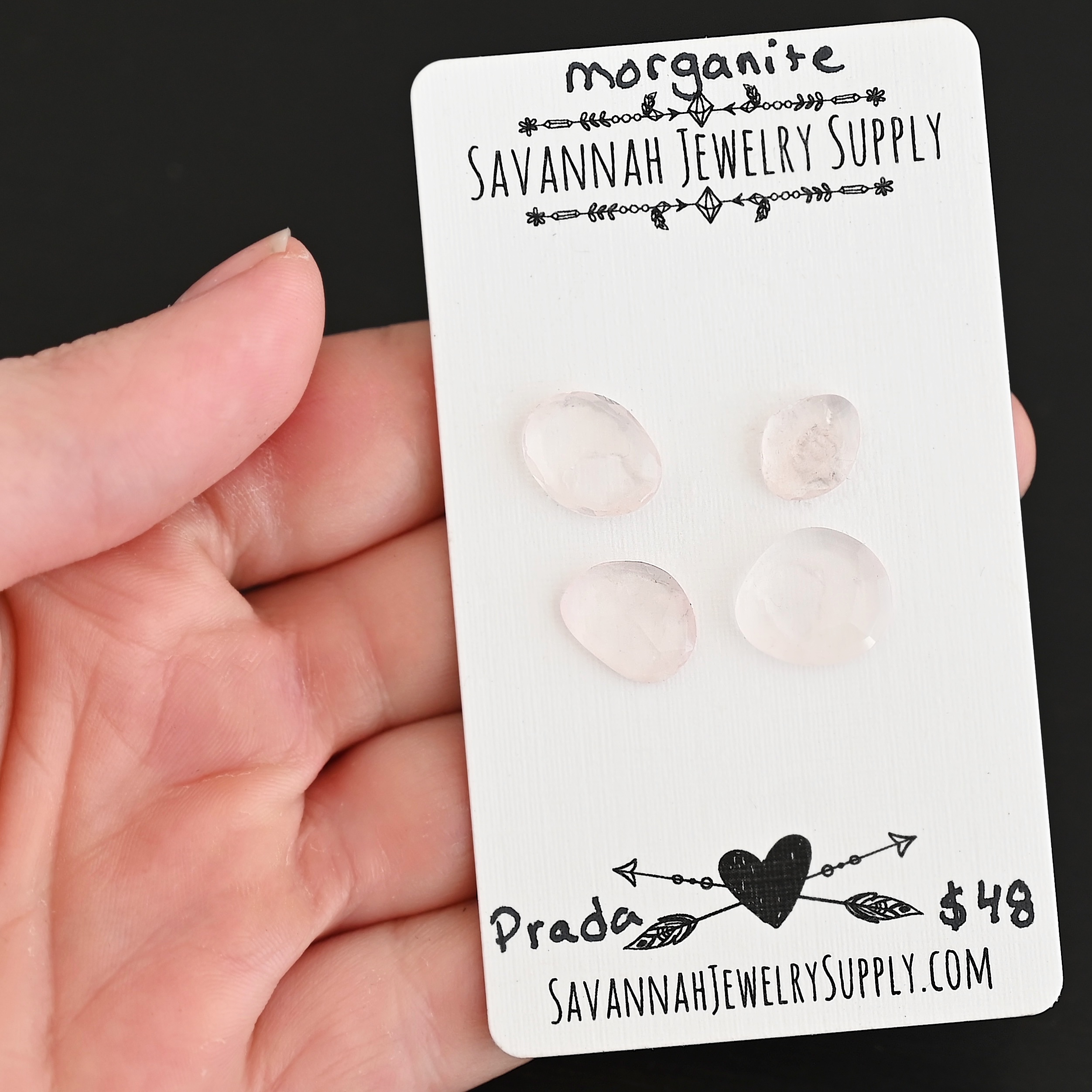 Prada Rose Cut Morganite Cabochon Parcel shown in hand