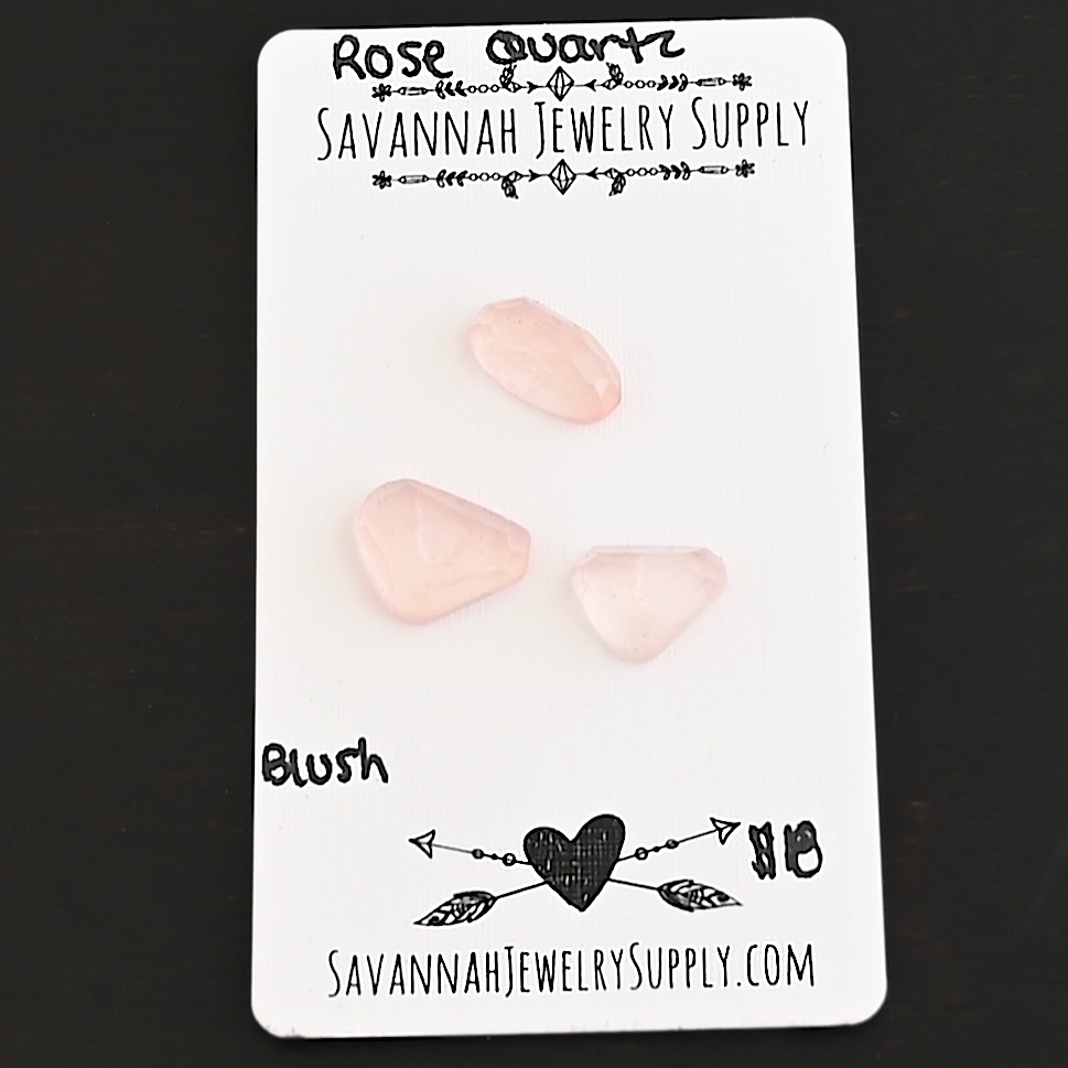 Blush Rose Cut Rose Quartz Cabochon Parcel shown on business card