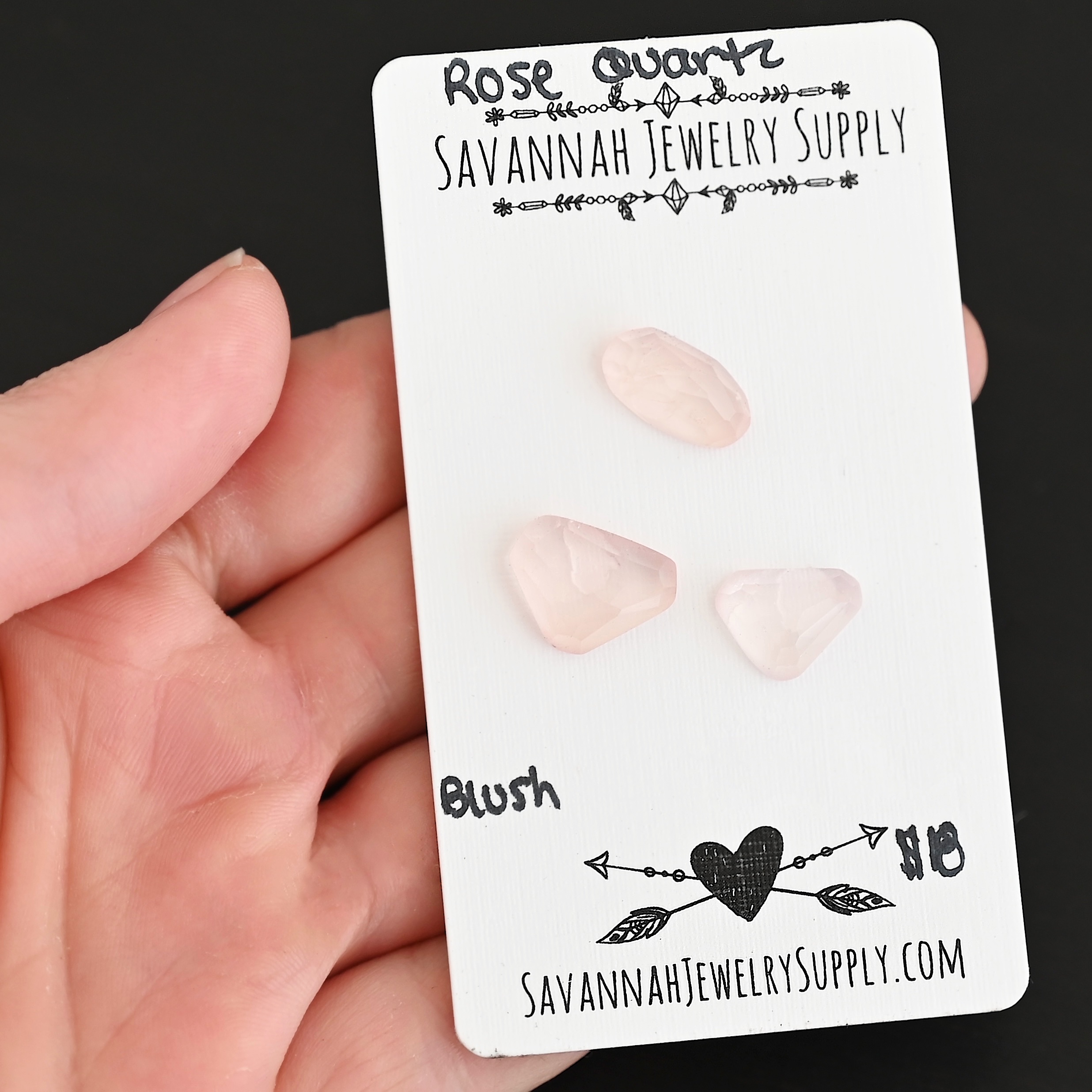 Blush Rose Cut Rose Quartz Cabochon Parcel shown in hand