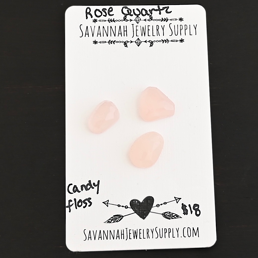 Candy Floss Rose Cut Rose Quartz Cabochon Parcel shown on business card