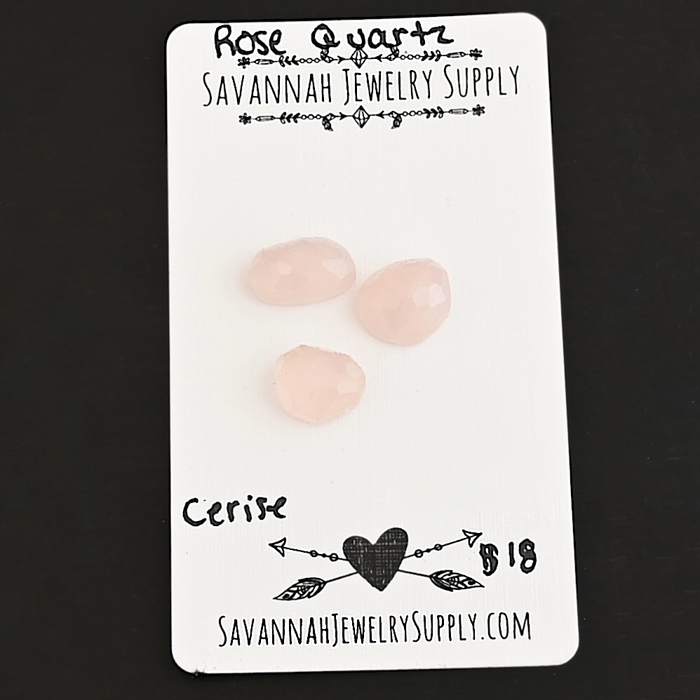 Cerise Rose Cut Rose Quartz Cabochon Parcel shown on business card
