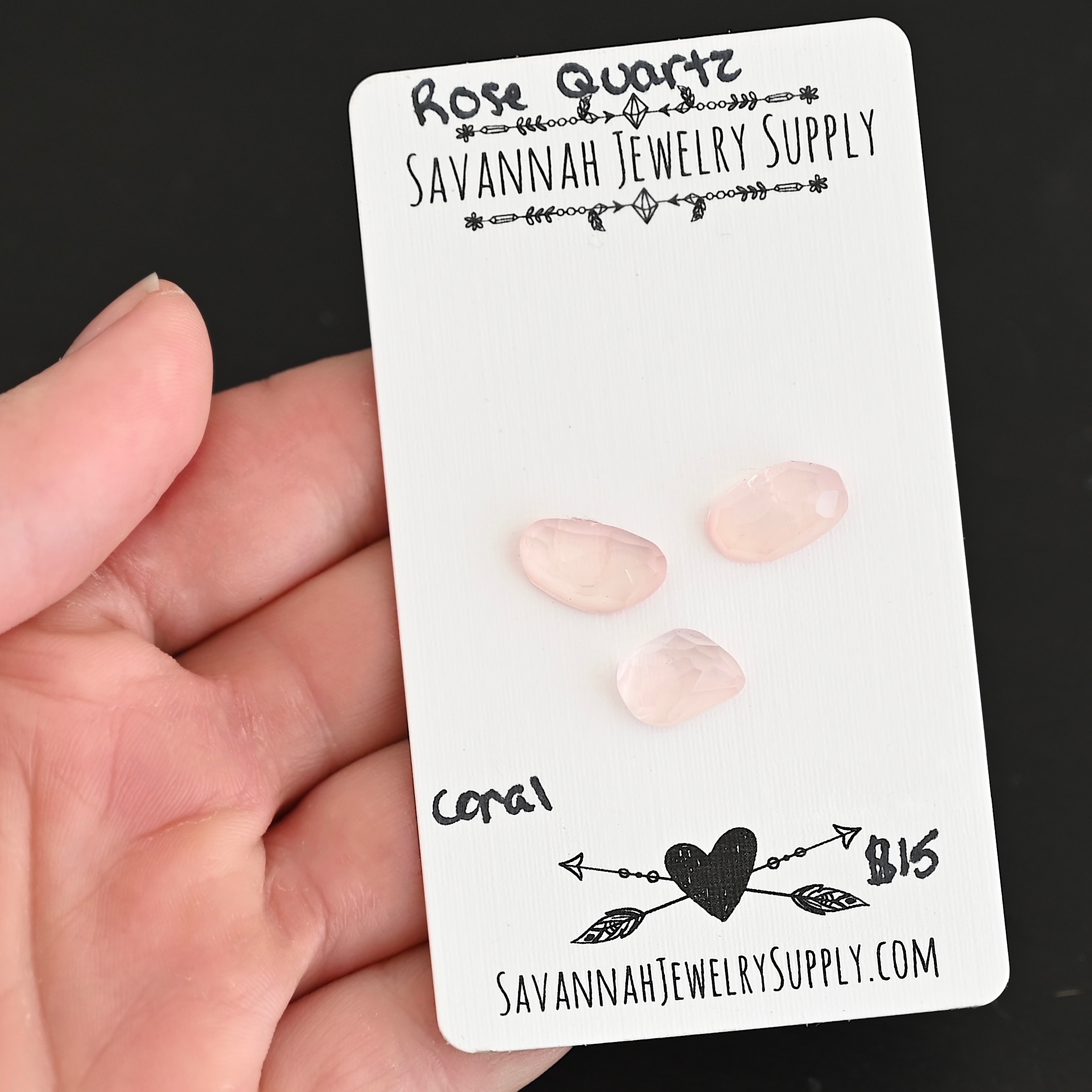 Coral Rose Cut Rose Quartz Cabochon Parcel shown in hand