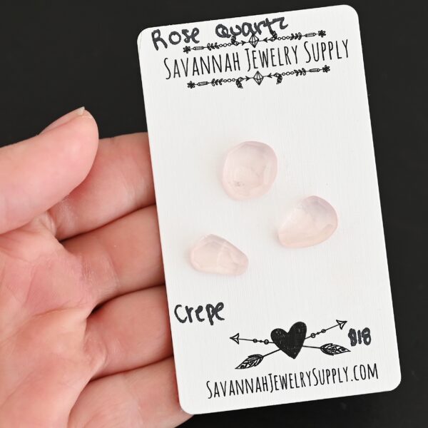 Crepe Rose Cut Rose Quartz Cabochon Parcel shown in hand