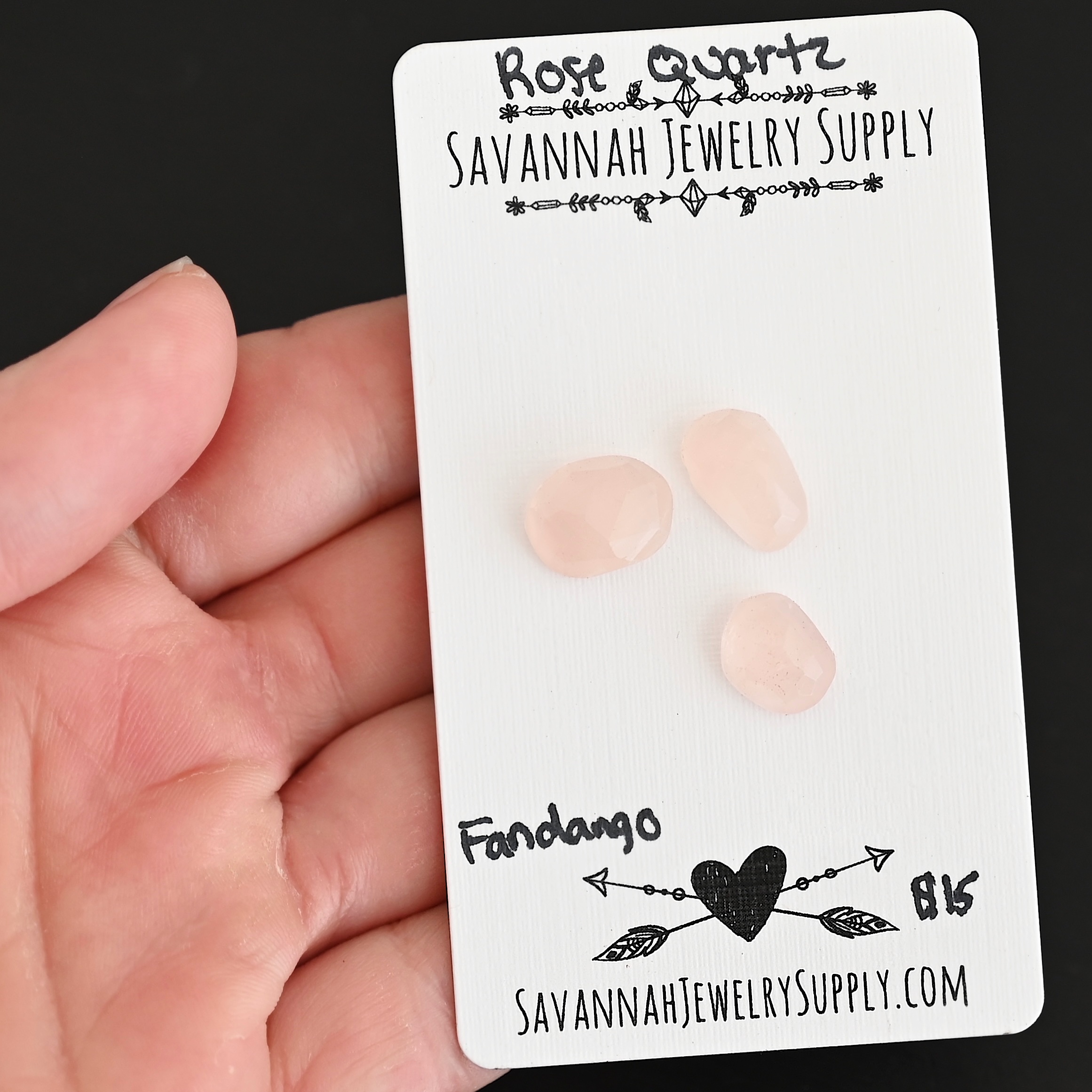 Fandango Rose Cut Rose Quartz Cabochon Parcel shown in hand