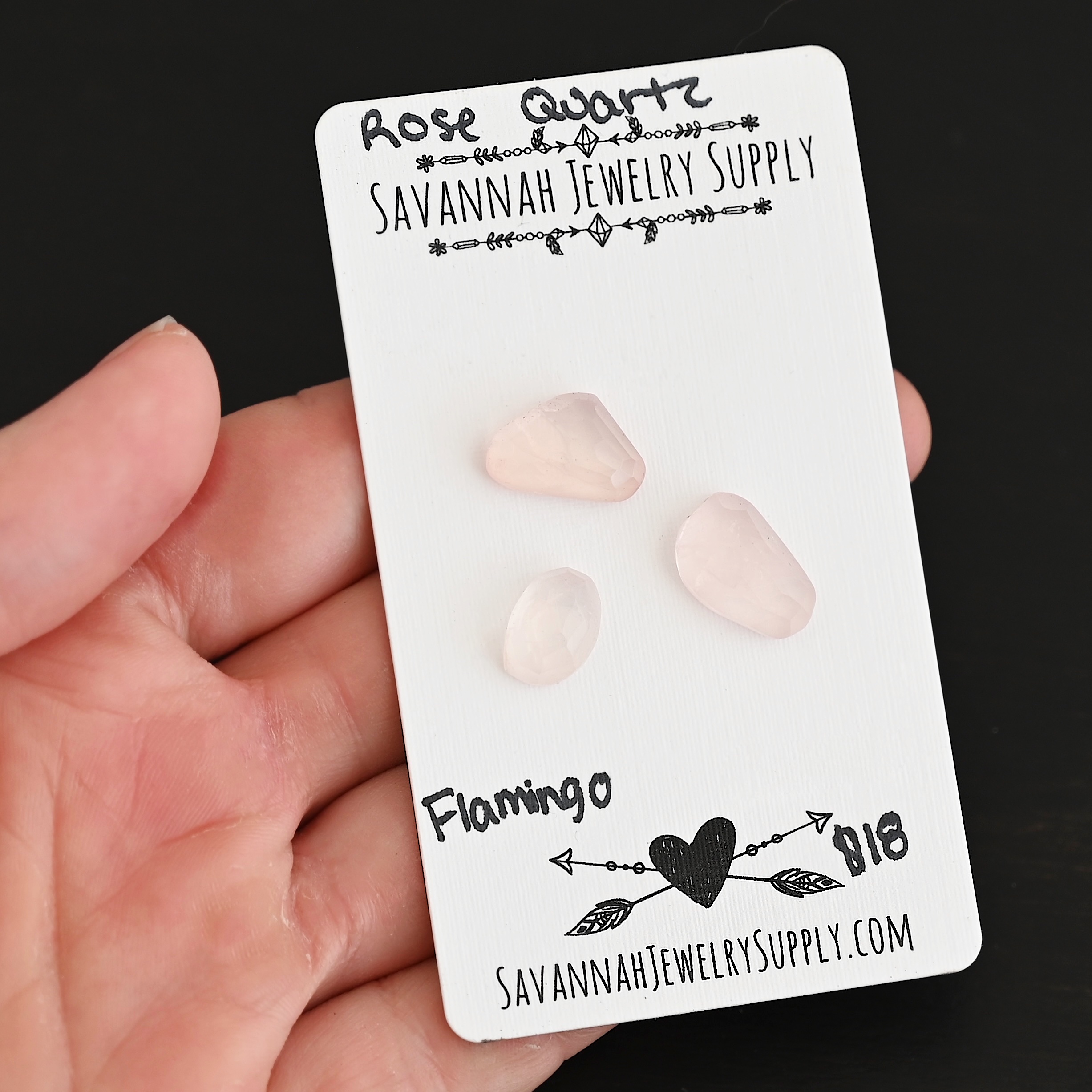 Flamingo Rose Cut Rose Quartz Cabochon Parcel shown in hand