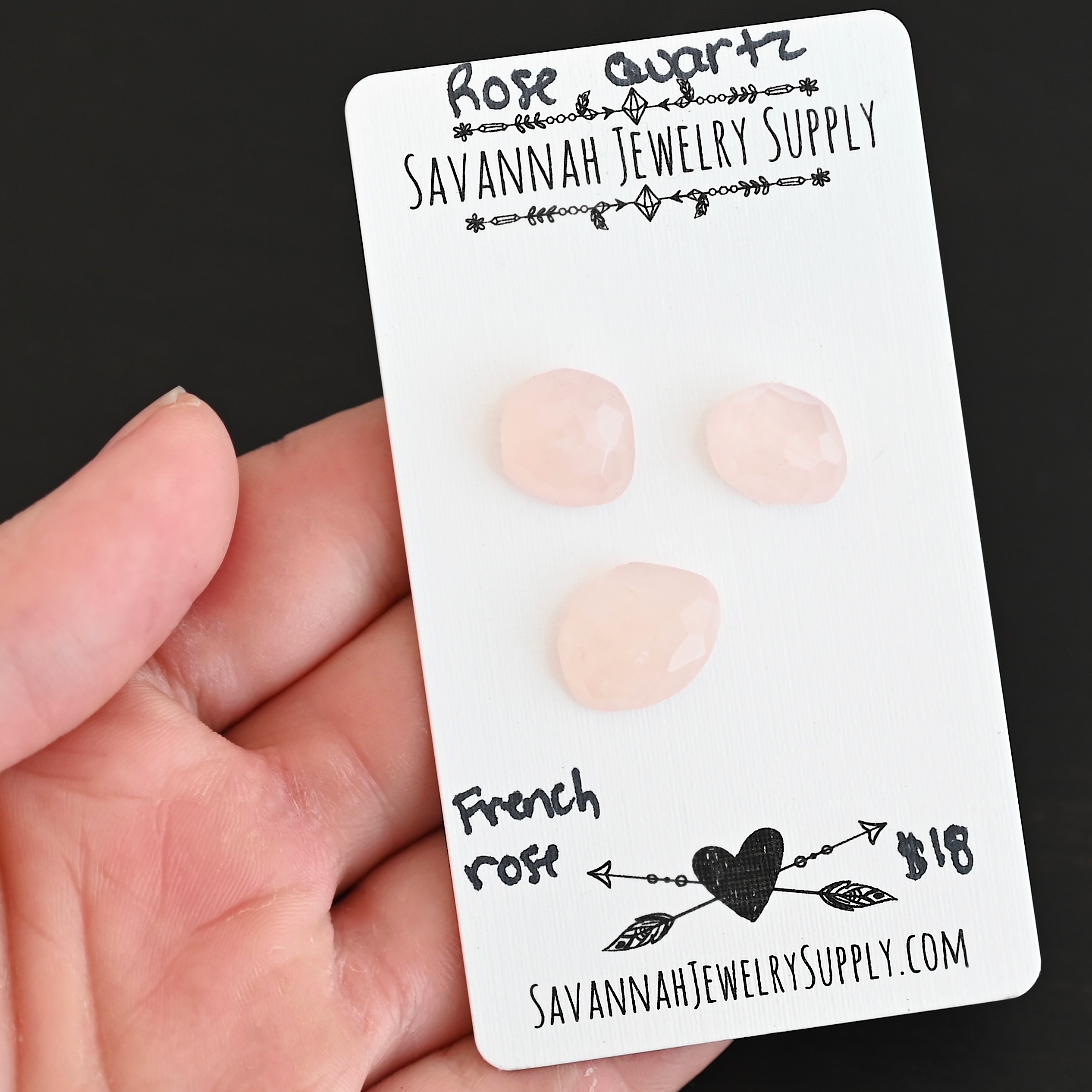 French Rose Rose Cut Rose Quartz Cabochon Parcel shown in hand