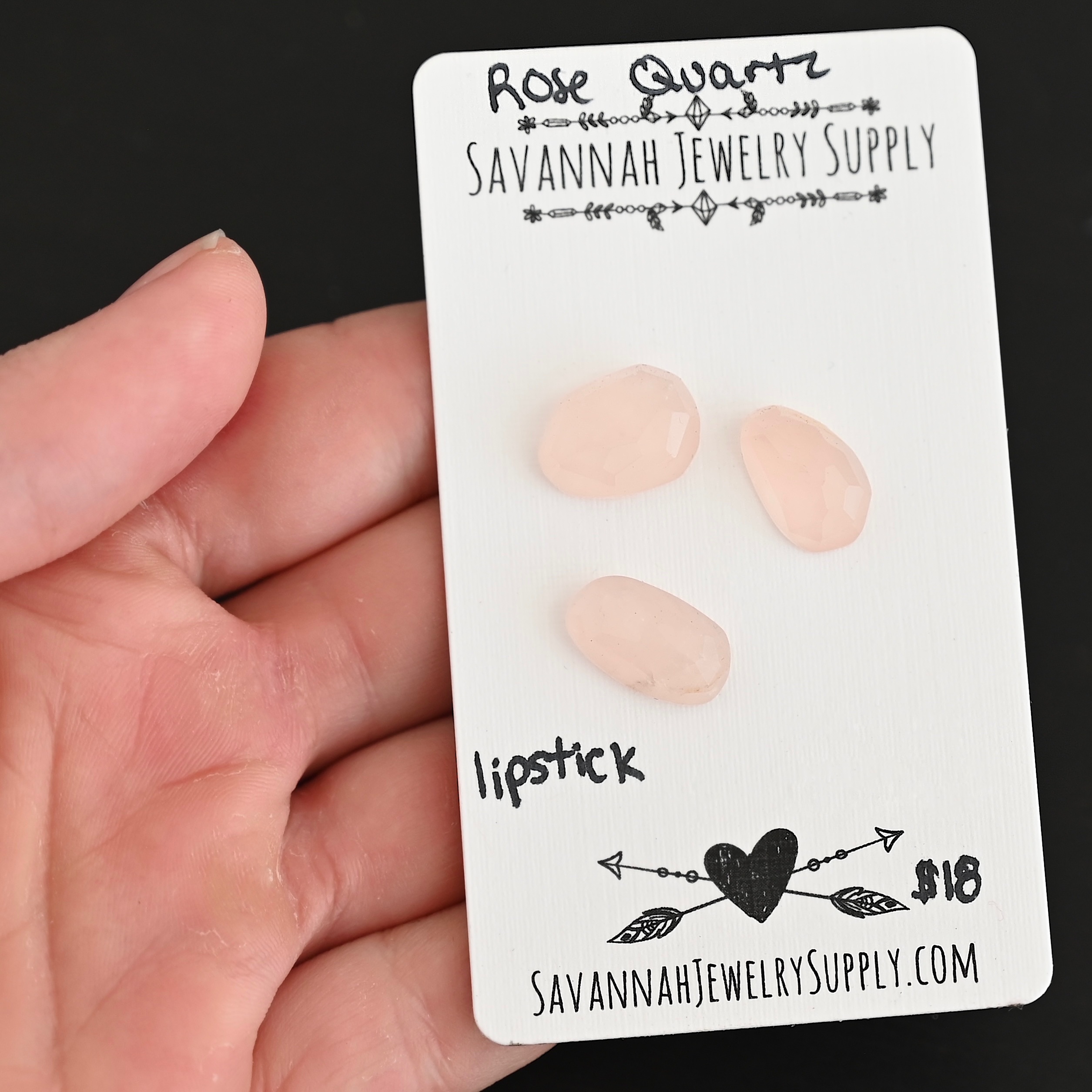 Lipstick Rose Cut Rose Quartz Cabochon Parcel shown in hand