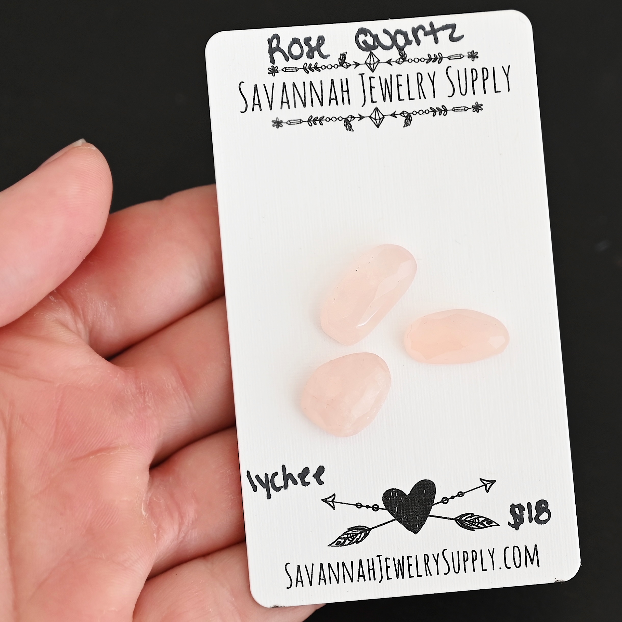 Lychee Rose Cut Rose Quartz Cabochon Parcel shown in hand