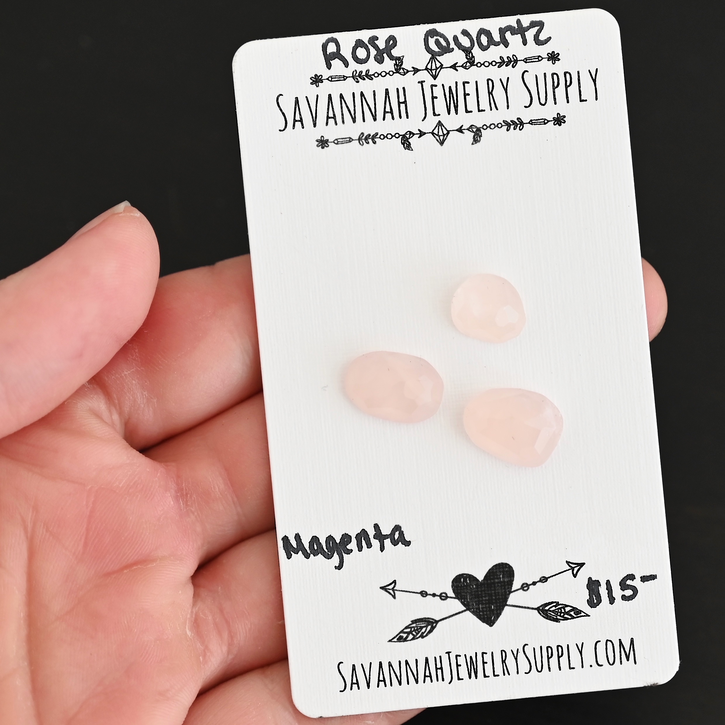 Magenta Rose Cut Rose Quartz Cabochon Parcel shown in hand