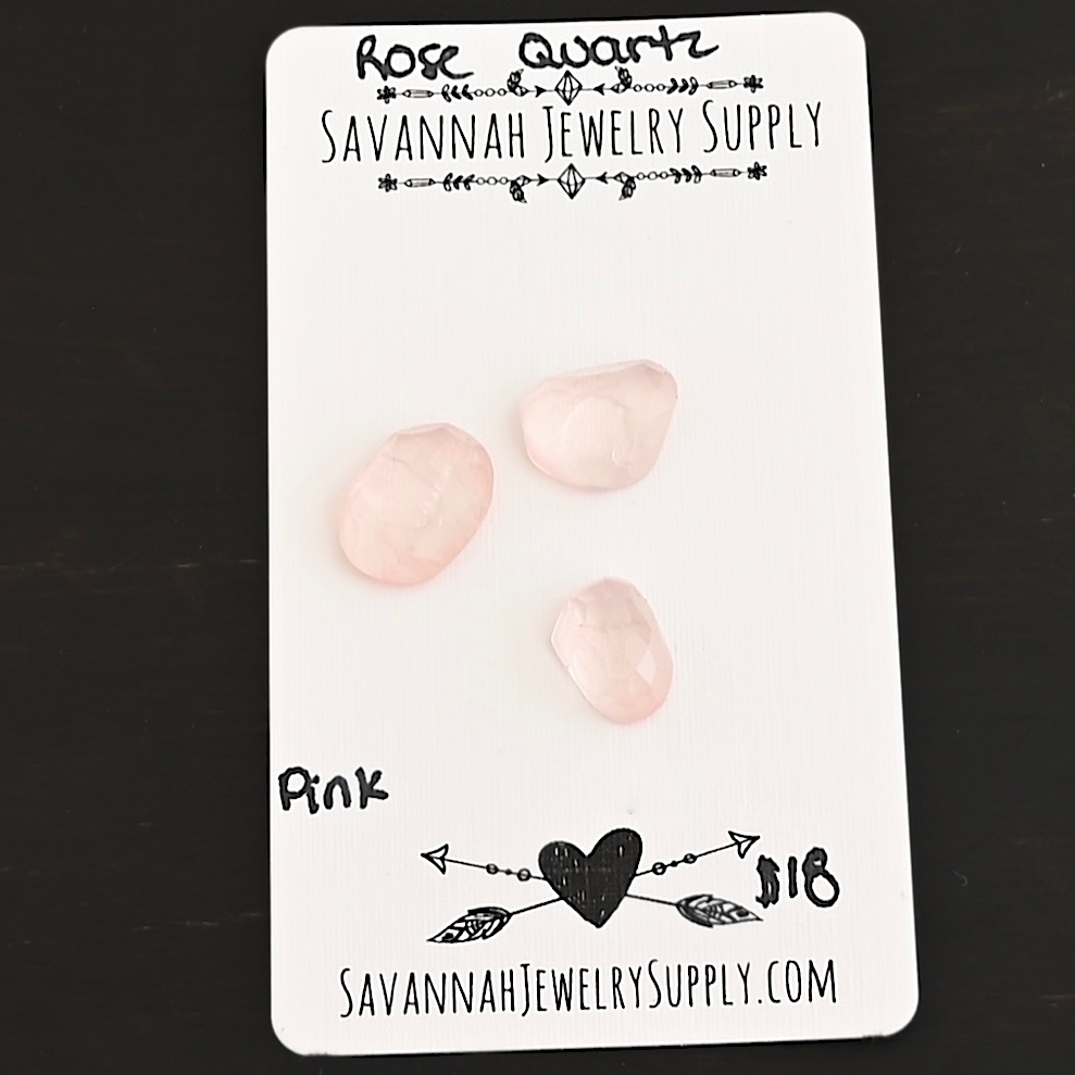 Pink Rose Cut Rose Quartz Cabochon Parcel shown on business card