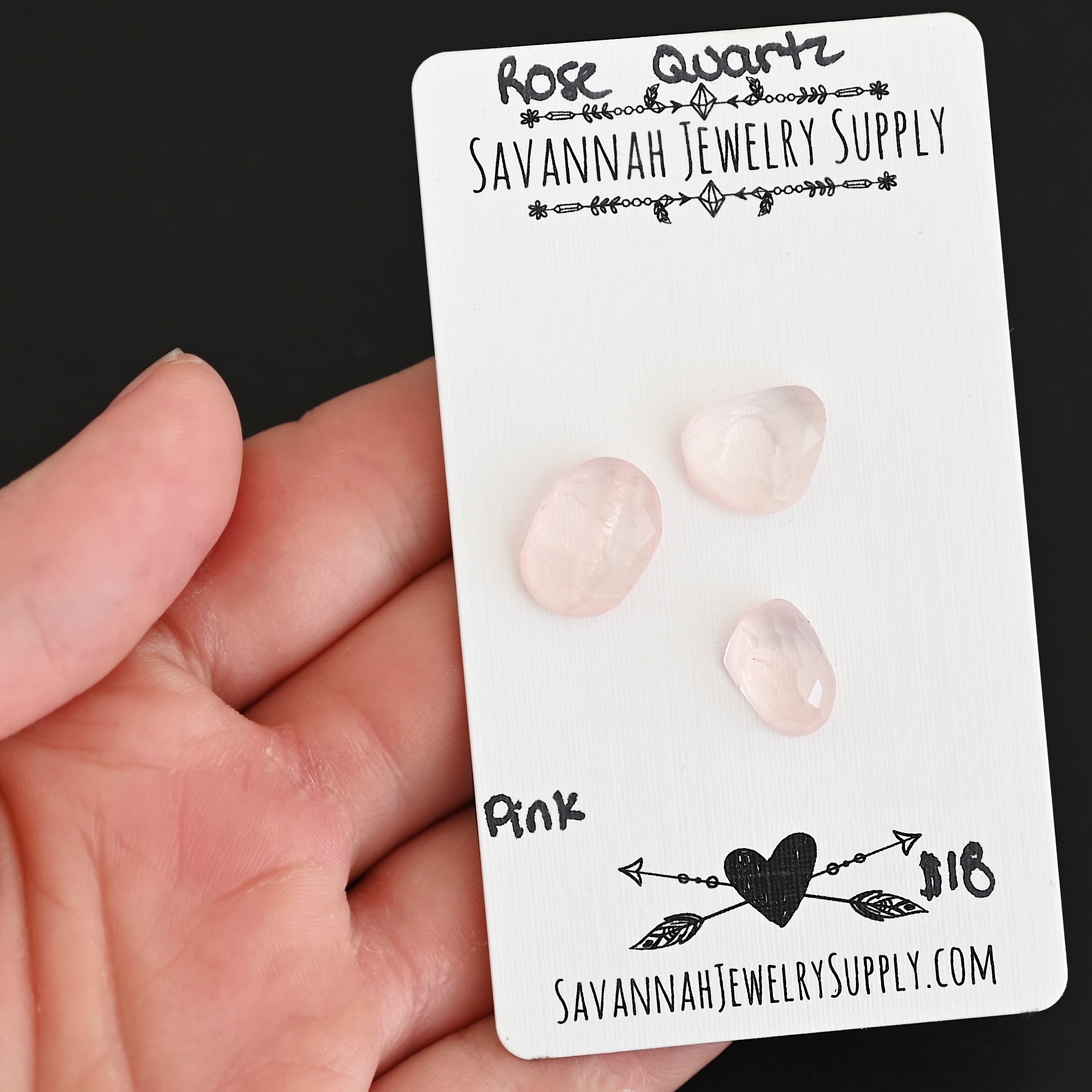 Pink Rose Cut Rose Quartz Cabochon Parcel shown in hand