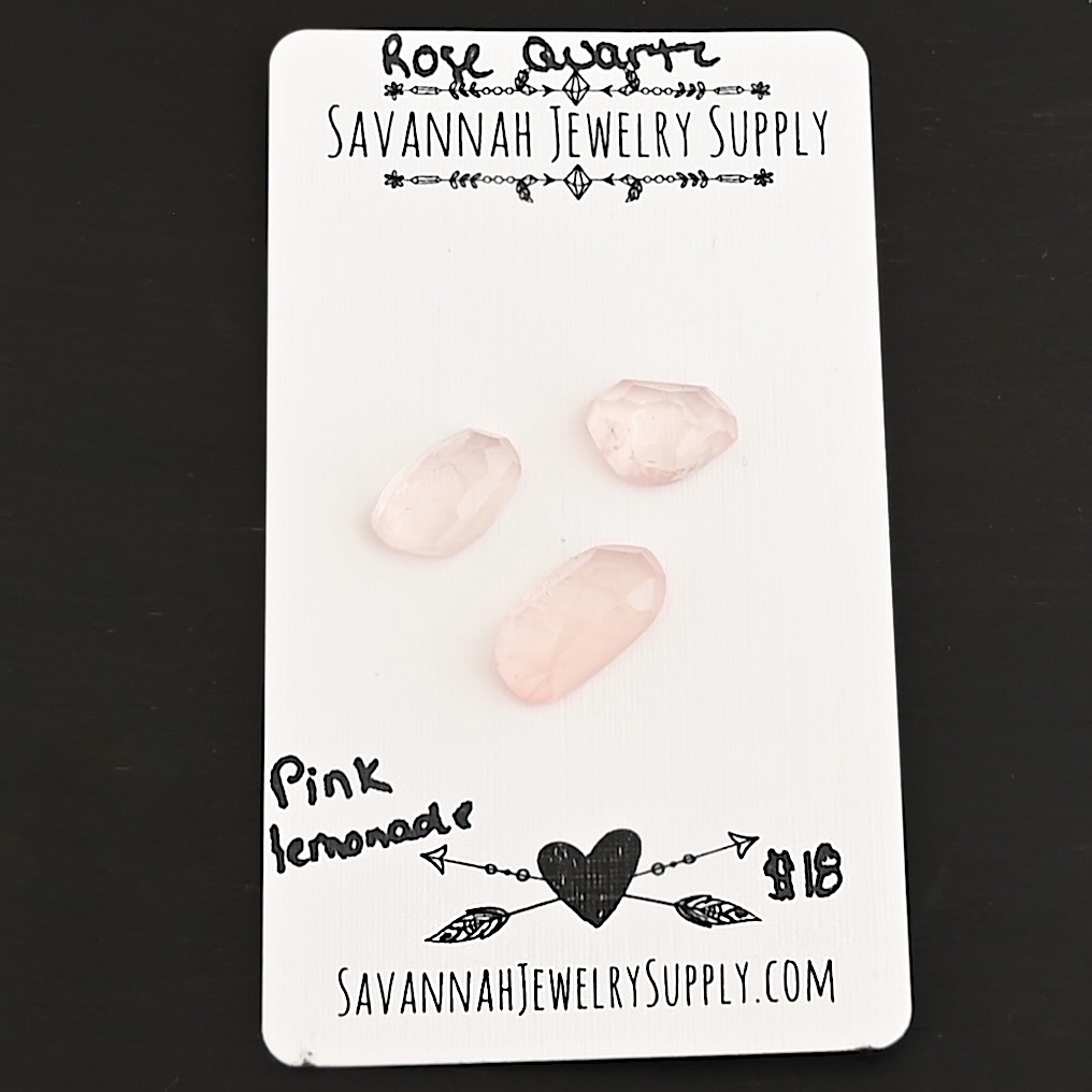 Pink Lemonade Rose Cut Rose Quartz Cabochon Parcel shown on business card