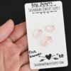 Pink Lemonade Rose Cut Rose Quartz Cabochon Parcel shown in hand