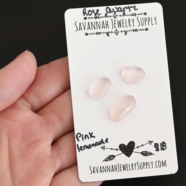 Pink Lemonade Rose Cut Rose Quartz Cabochon Parcel shown in hand