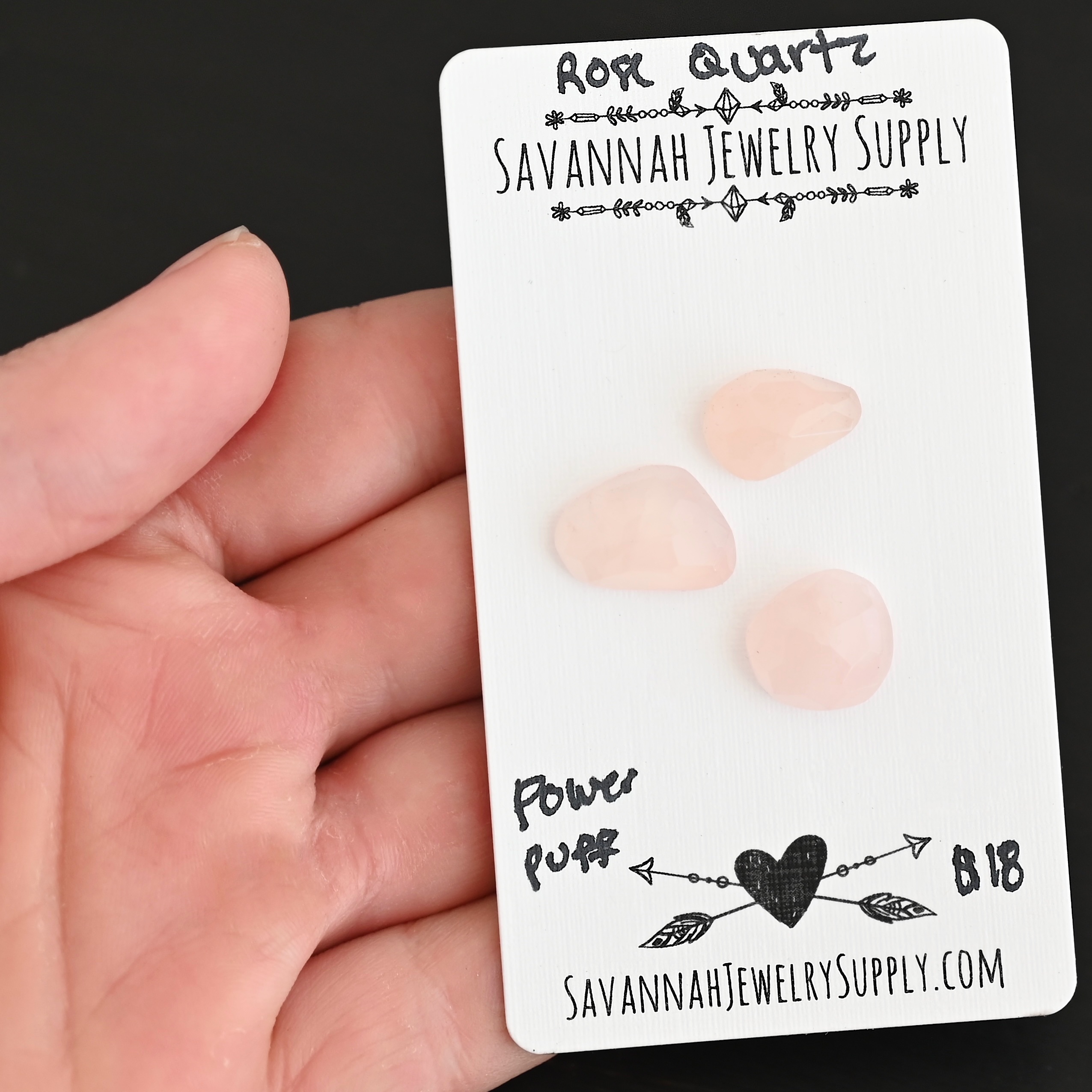 Power Puff Rose Cut Rose Quartz Cabochon Parcel shown in hand