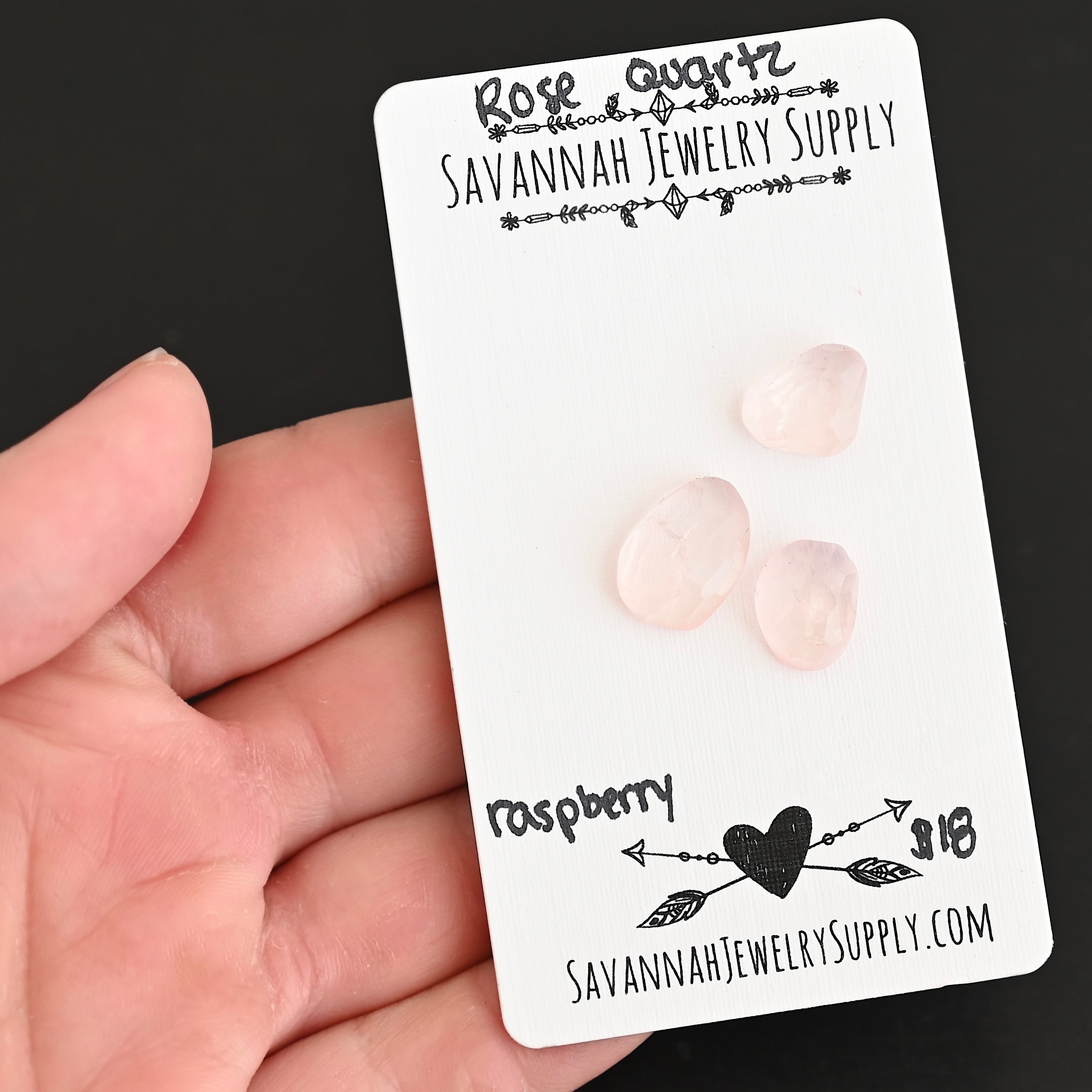 Raspberry Rose Cut Rose Quartz Cabochon Parcel shown in hand