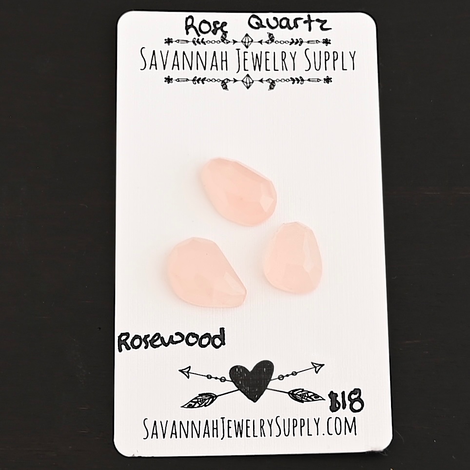 Rosewood Rose Cut Rose Quartz Cabochon Parcel shown on business card