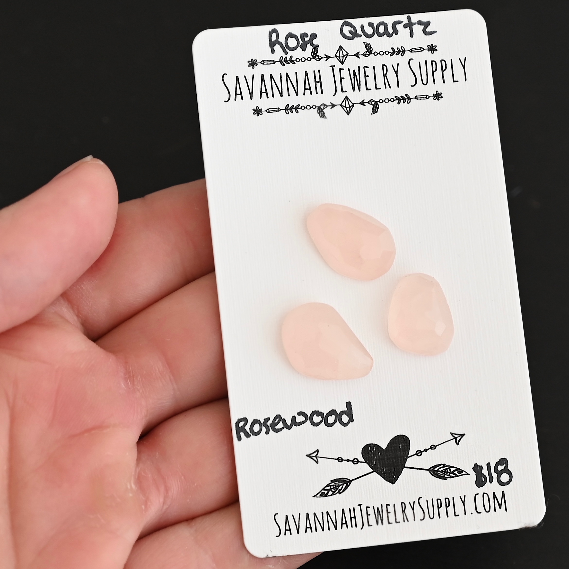 Rosewood Rose Cut Rose Quartz Cabochon Parcel shown in hand