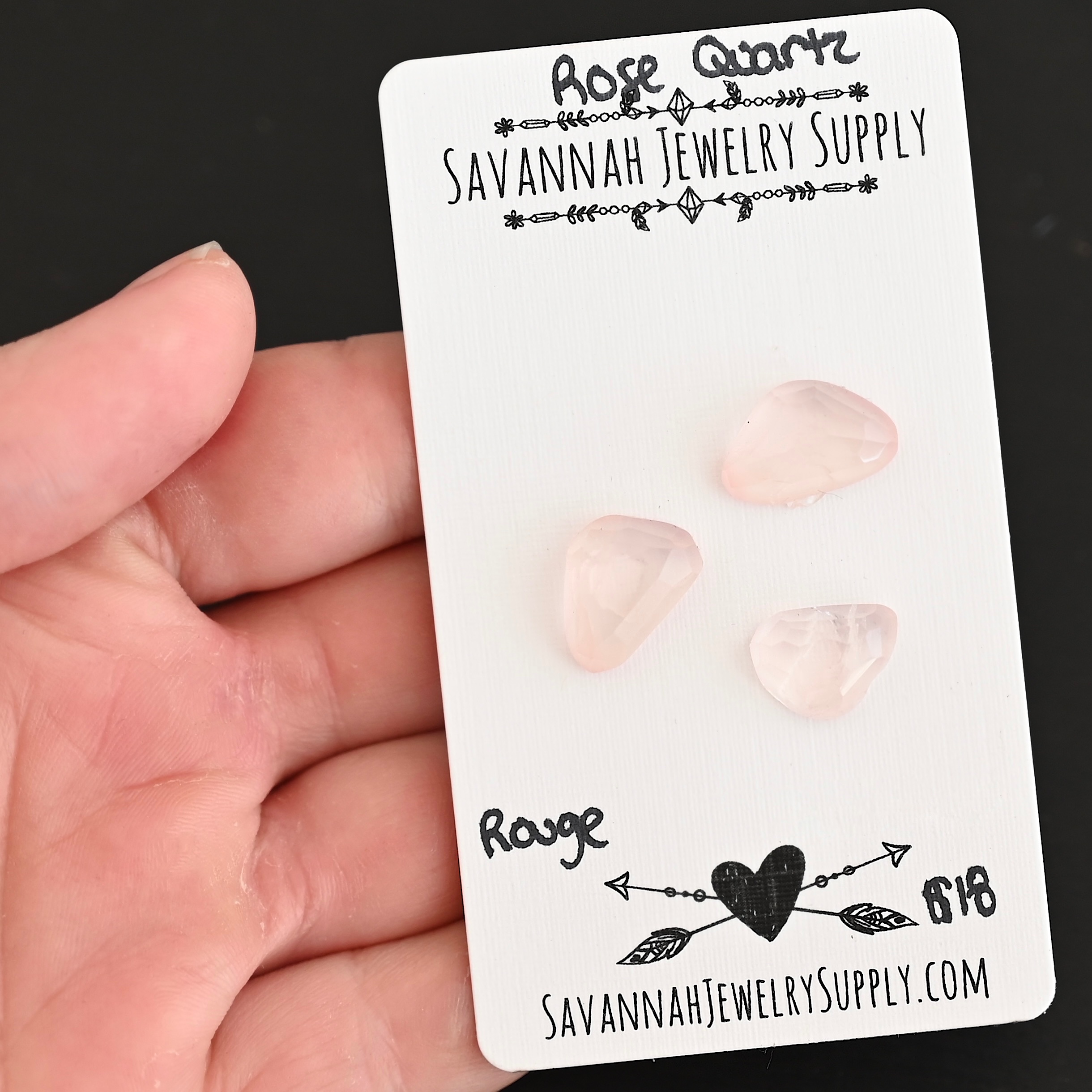 Rouge Rose Cut Rose Quartz Cabochon Parcel shown in hand