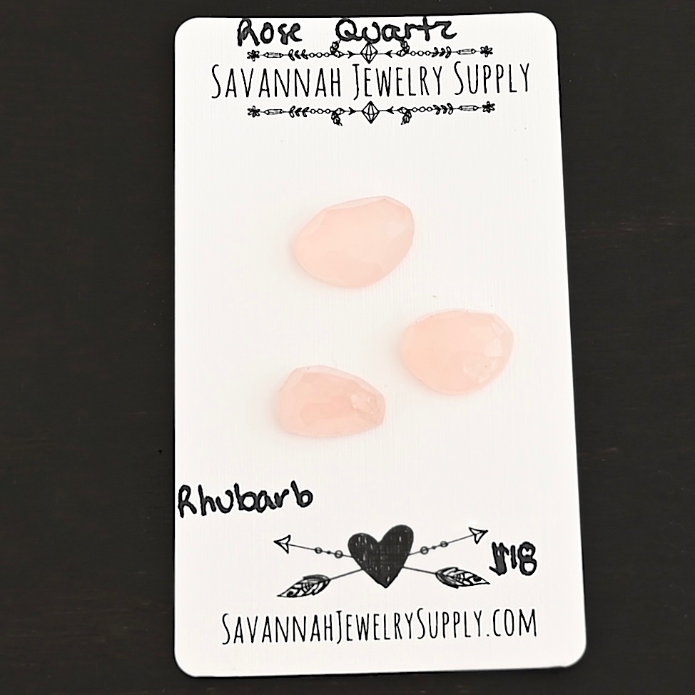 Rhubarb Rose Cut Rose Quartz Cabochon Parcel shown on business card