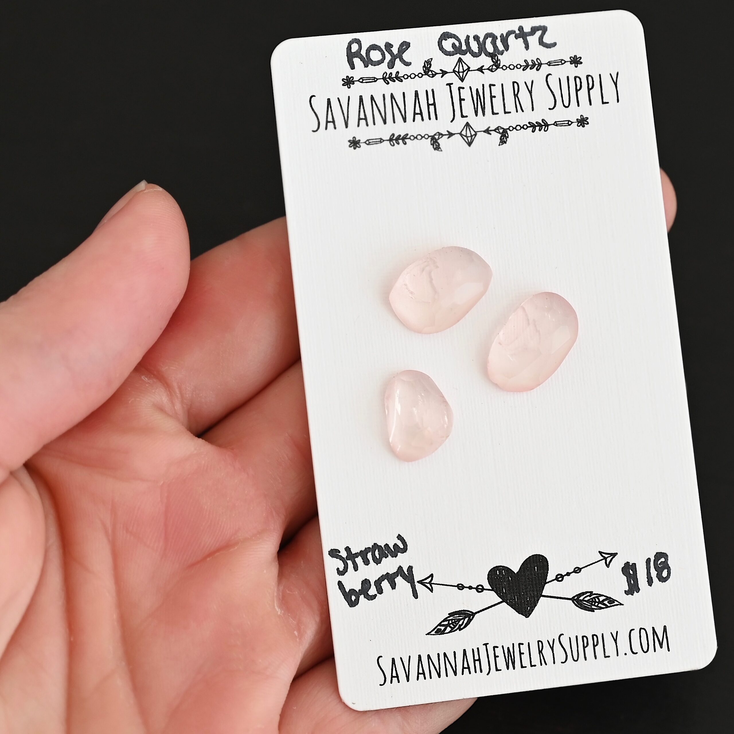 Strawberry Rose Cut Rose Quartz Cabochon Parcel shown in hand