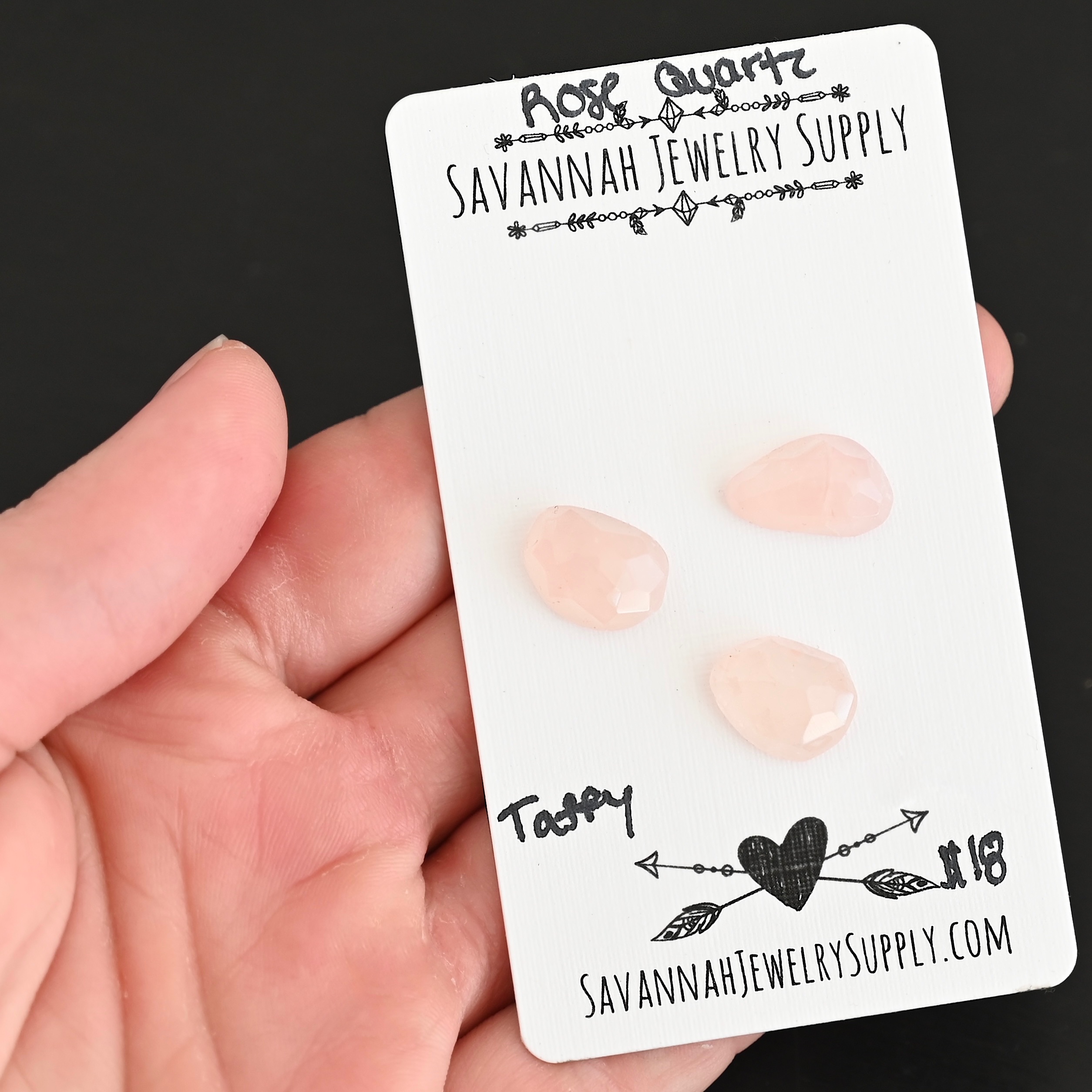 Taffy Rose Cut Rose Quartz Cabochon Parcel shown in hand