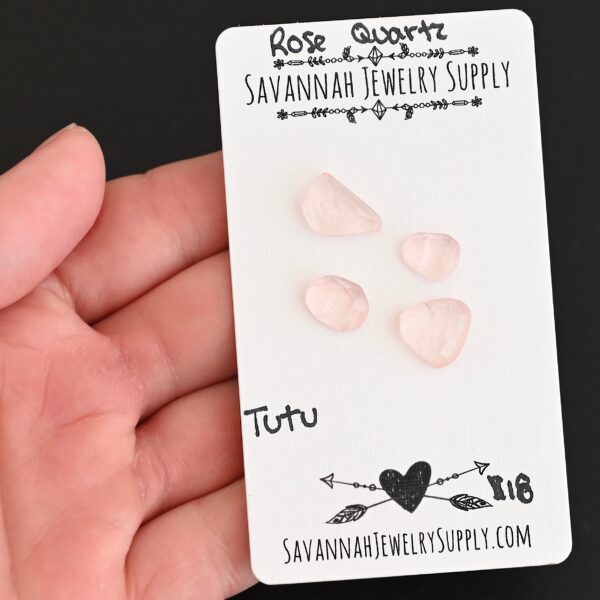 Tutu Rose Cut Rose Quartz Cabochon Parcel shown in hand
