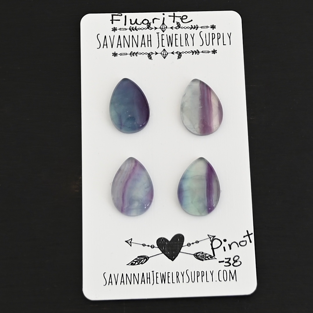 Pinot Fluorite Cabochon Parcel shown on business card