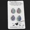 Chardonnay Fluorite Cabochon Parcel shown on business card
