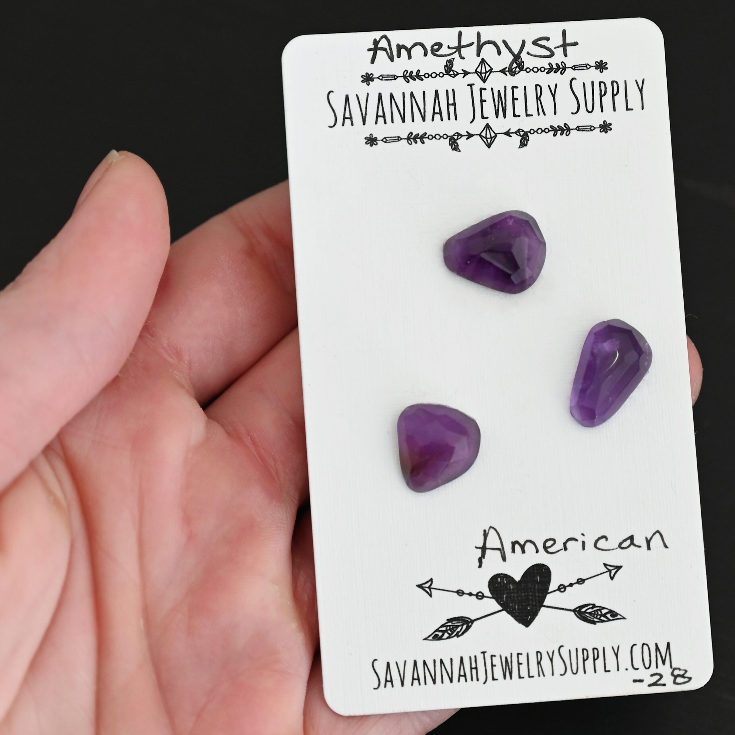 American Rose Cut Amethyst Cabochon Parcel shown in hand