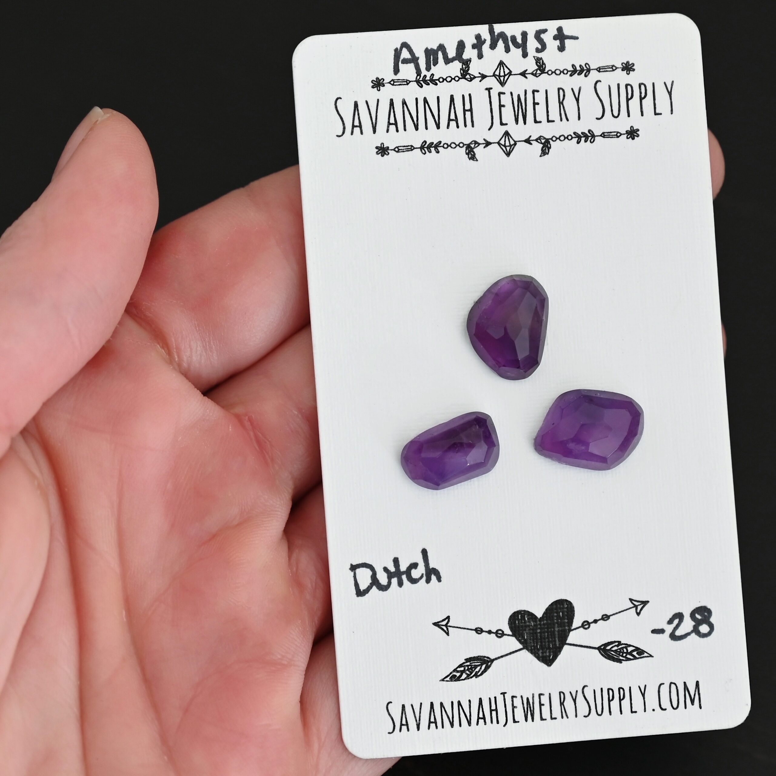 Dutch Rose Cut Amethyst Cabochon Parcel shown in hand