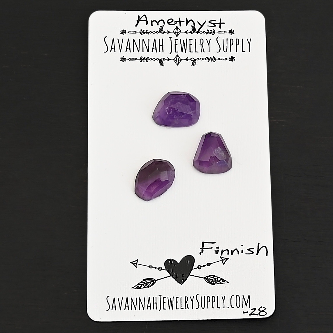 Finnish Rose Cut Amethyst Cabochon Parcel shown on business card
