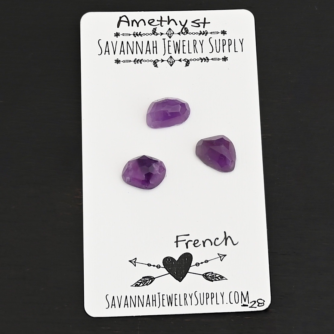 French Rose Cut Amethyst Cabochon Parcel shown on business card