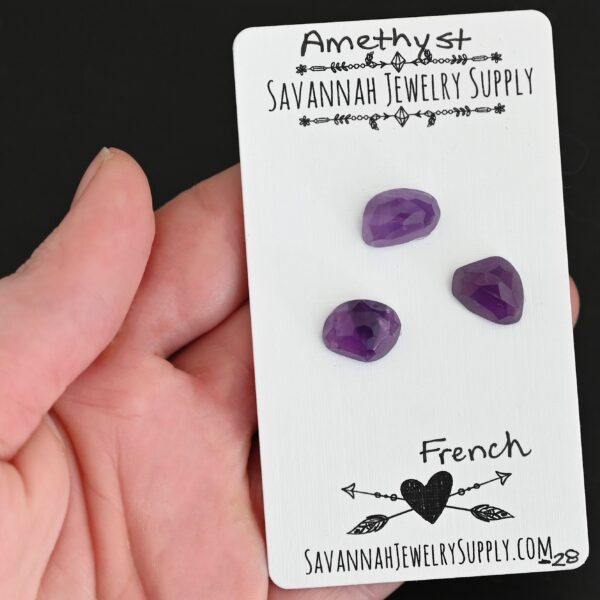 French Rose Cut Amethyst Cabochon Parcel shown in hand