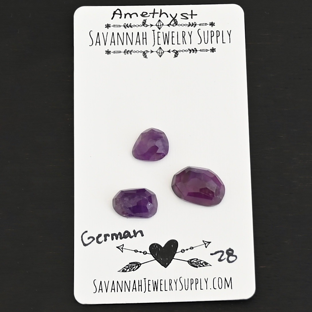 German Rose Cut Amethyst Cabochon Parcel shown on business card
