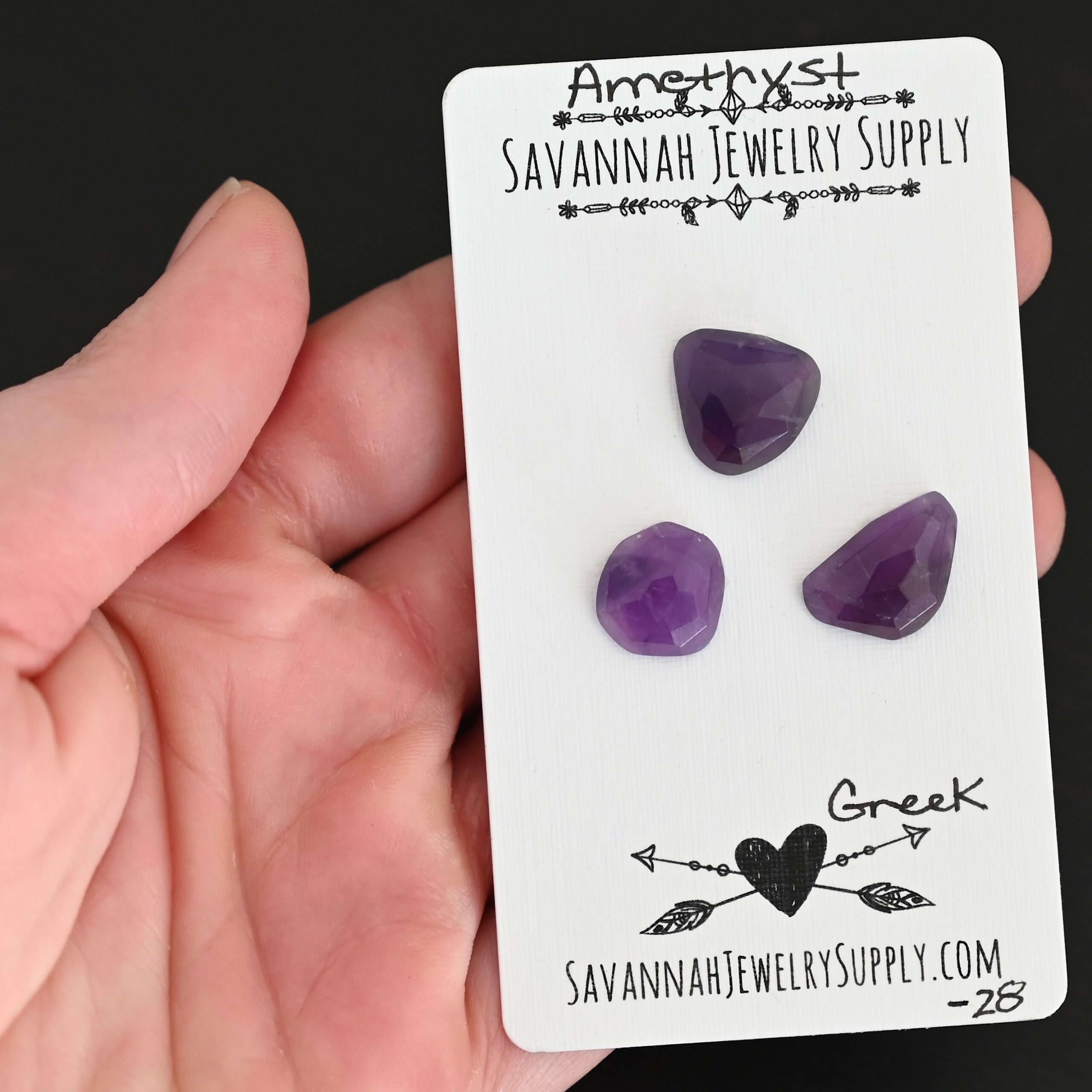 Greek Rose Cut Amethyst Cabochon Parcel shown in hand