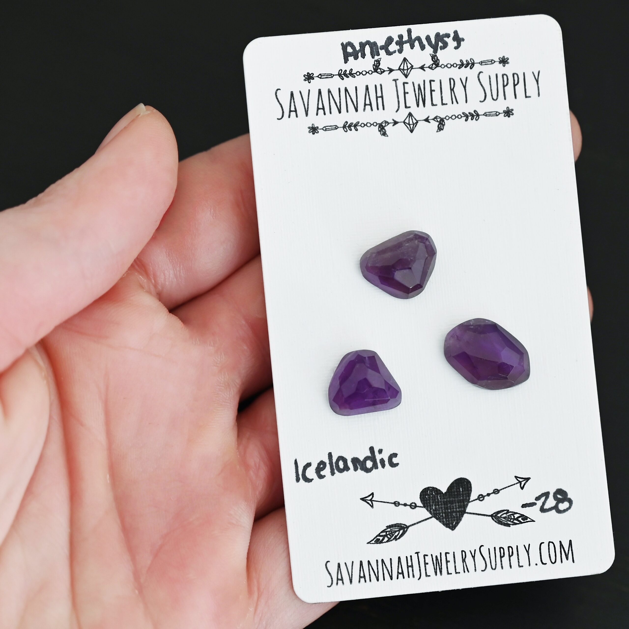 Icelandic Rose Cut Amethyst Cabochon Parcel shown in hand