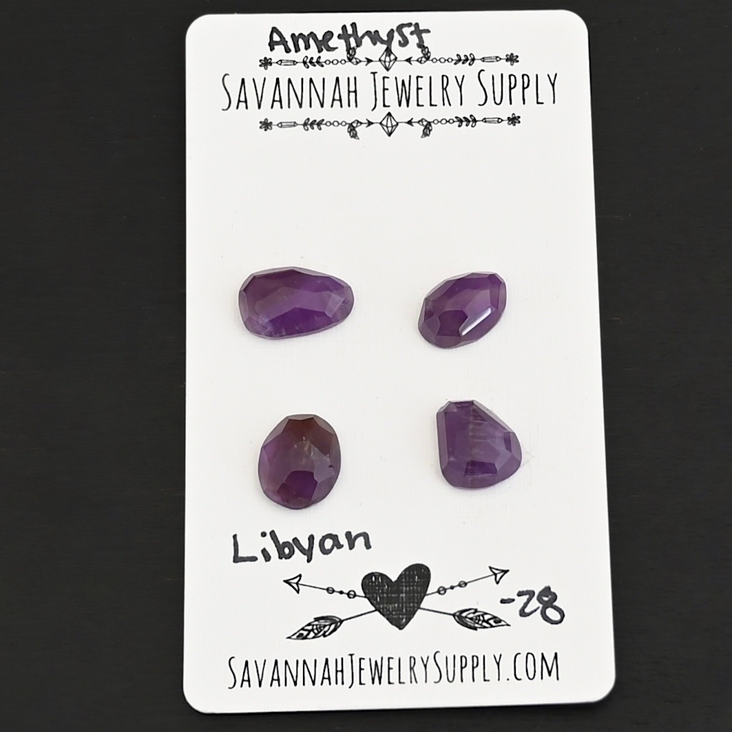 Libyan Rose Cut Amethyst Cabochon Parcel shown on business card